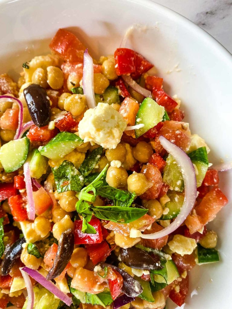 Salad with chickpeas, tomatoes, onions, tomatoes, feta- by Caramel And Spice