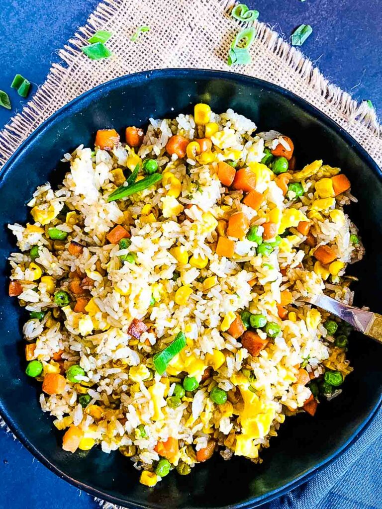 fried vegetables rice with frozen vegetables in a bowl