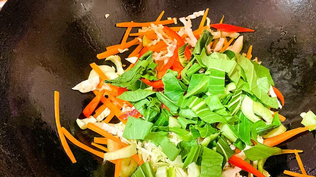 what is chow mein
vegetables in wok for chow mein