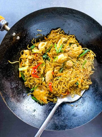 house special chow mein noodles in wok and ladle