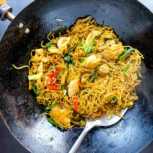 house special chow mein noodles in wok and ladle