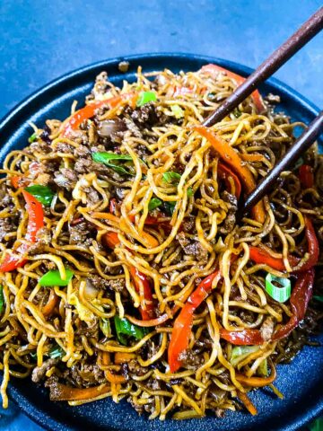 Ground Beef Stir Fry Noodles In Bowl With Chopsticks