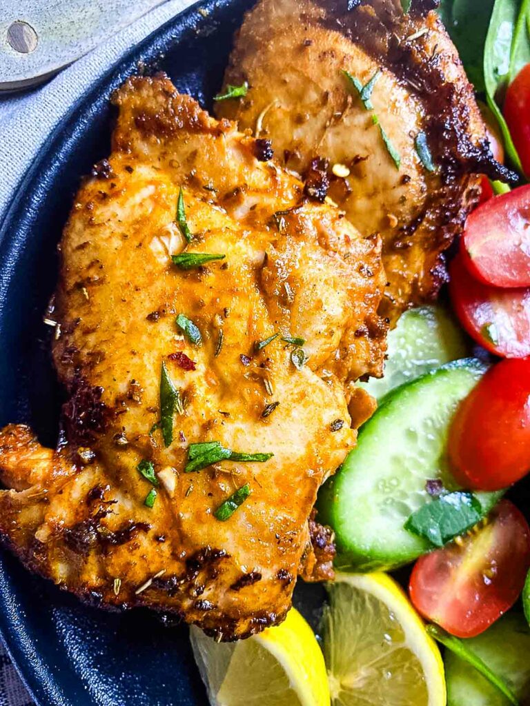 air fryer fried chicken thighs with tomatoes and cucumbers