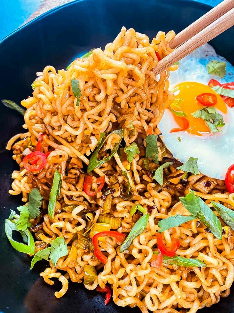 Chilli Ramen Noodles with fried egg and chopsticks