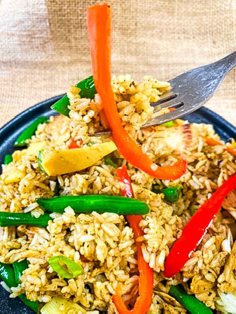 Fried rice picked by fork.