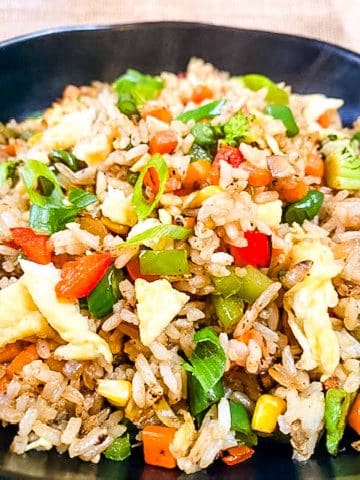 Fried rice with vegetables in a bowl.