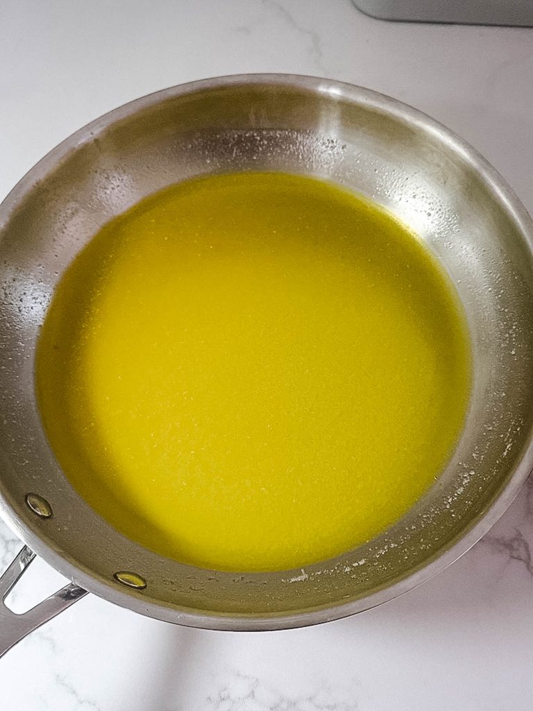 Butter melting in a saucepan for homemade buffalo sauce