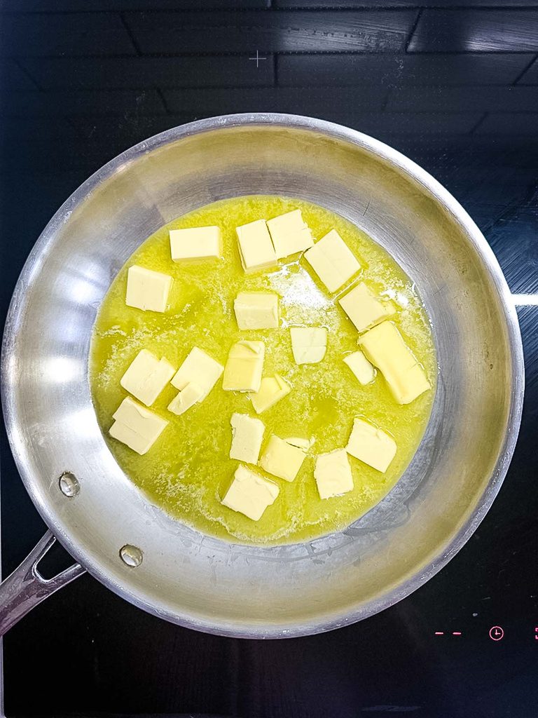 Butter melting in a saucepan for homemade buffalo sauce